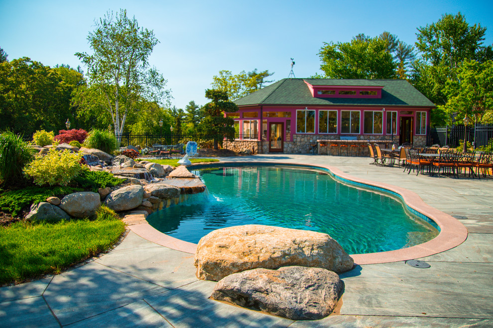 Pool house - large eclectic backyard stone and custom-shaped natural pool house idea in Boston