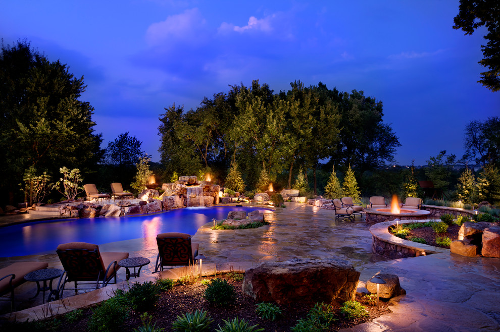 Mountain style custom-shaped pool photo in Kansas City