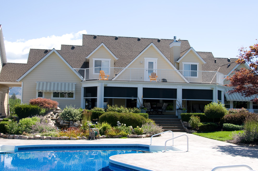 Retractable screens help bring the outside in Kelowna BC Traditional Pool Vancouver by