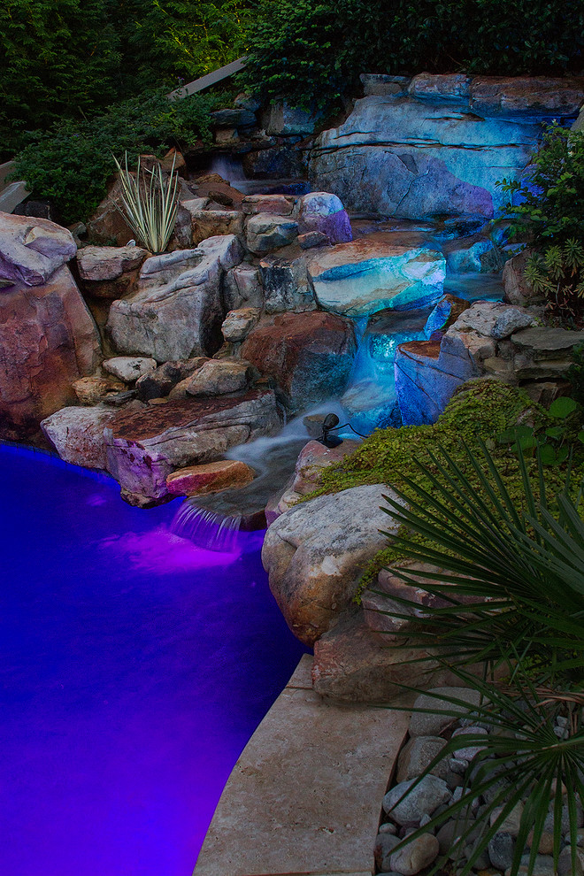 Inspiration for a large eclectic backyard stone and custom-shaped natural pool fountain remodel in Raleigh