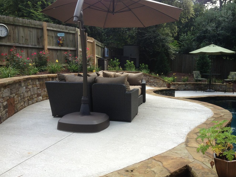 Pool - mid-sized traditional backyard concrete and custom-shaped lap pool idea in Atlanta