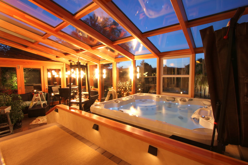 Trendy backyard rectangular aboveground hot tub photo in Other with decking