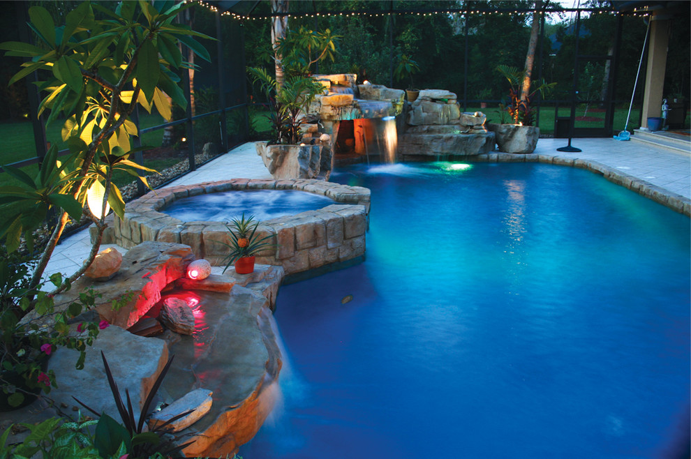 Mountain style backyard pool fountain photo in Jacksonville