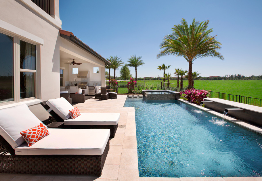 Hot tub - large contemporary backyard stone and rectangular lap hot tub idea in Miami