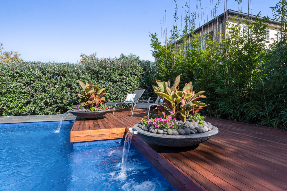 Pool fountain - mid-sized contemporary backyard stone and rectangular natural pool fountain idea in Melbourne