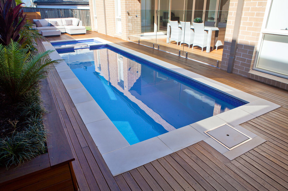 Pool - small contemporary rectangular pool idea in Sydney with decking