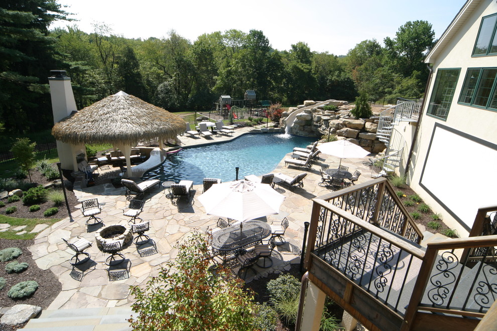 Salt water pool with grotto, waterslide, swim up bar in PA Tropical Swimming Pool & Hot Tub