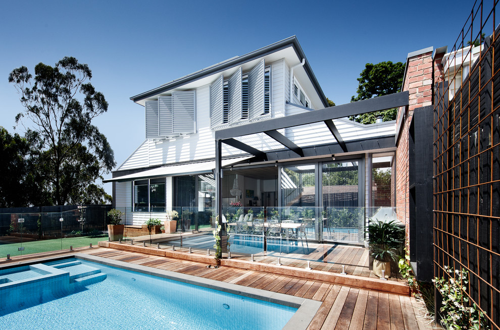 Pool - contemporary backyard rectangular pool idea in Melbourne with decking
