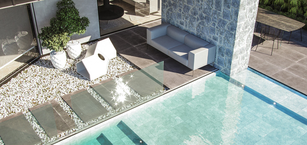 Idee per una piscina monocorsia nordica rettangolare di medie dimensioni e davanti casa con paesaggistica bordo piscina e pedane