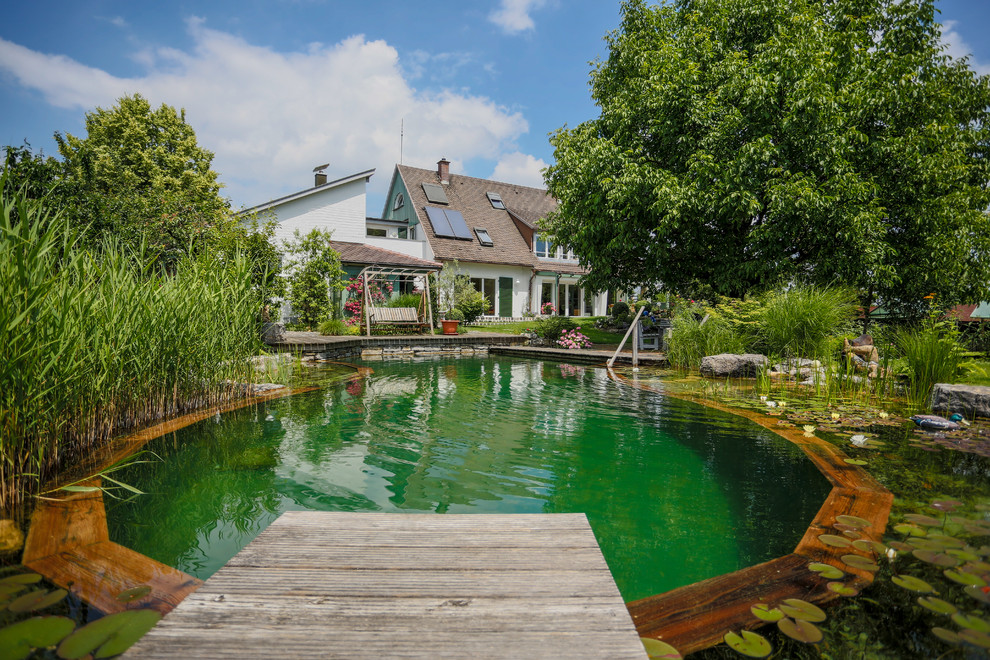 Design ideas for a farmhouse swimming pool in Stuttgart.