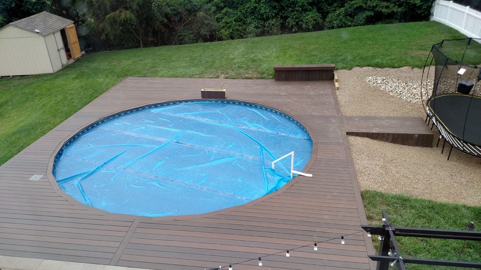Inspiration for a medium sized back round swimming pool in Other with decking.