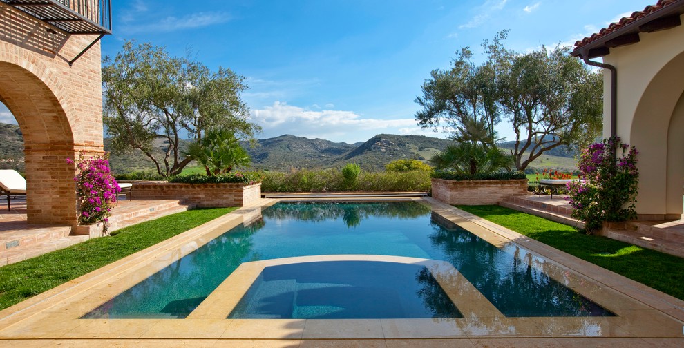 Tuscan rectangular pool photo in Orange County
