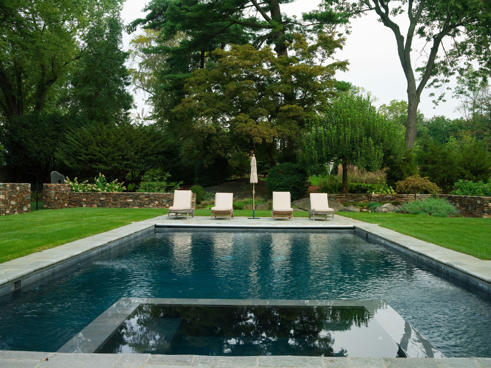 Ornate rectangular pool photo in New York