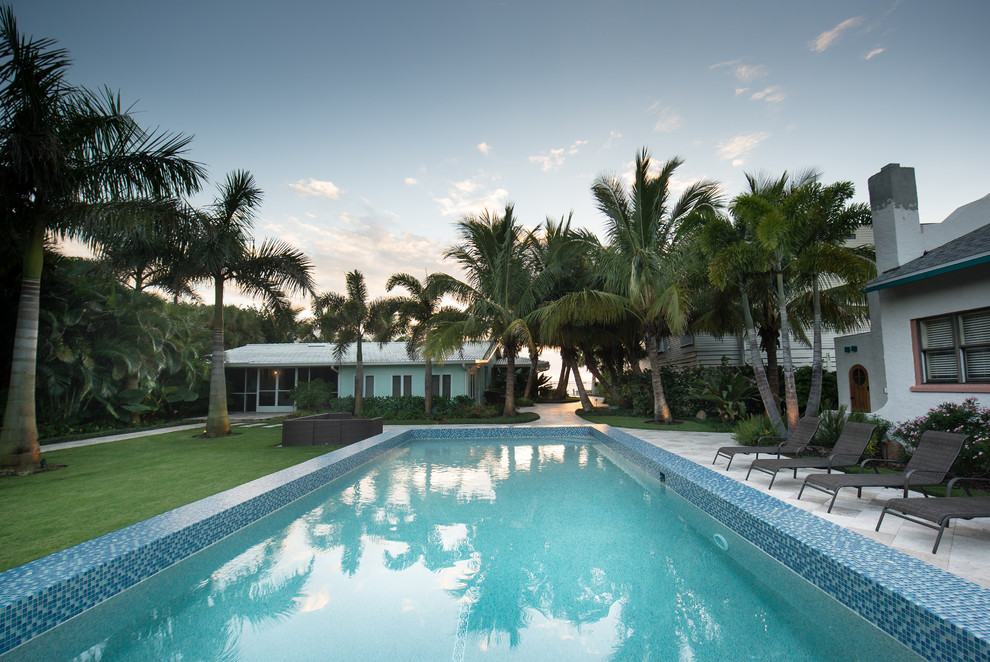 Island style pool photo in Tampa