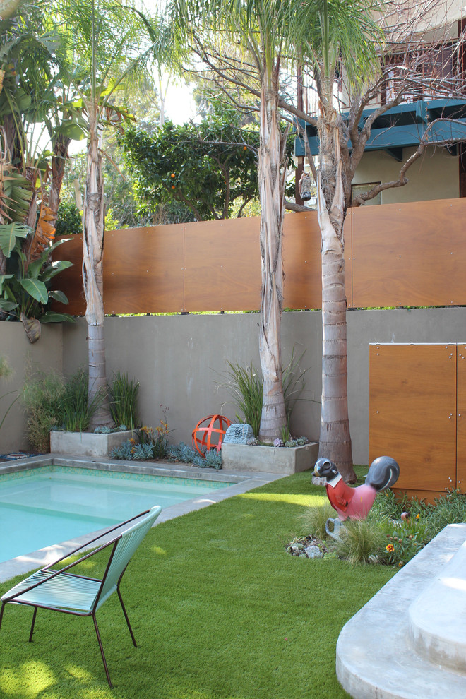 Inspiration for a contemporary backyard rectangular pool remodel in Los Angeles