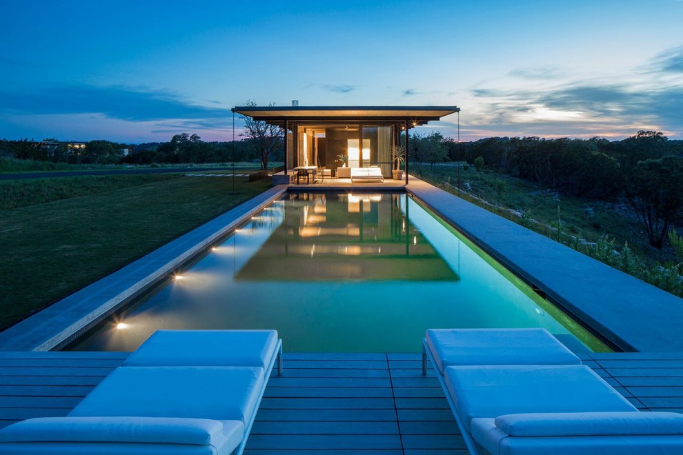 Inspiration for a contemporary rectangular pool remodel in New York with decking