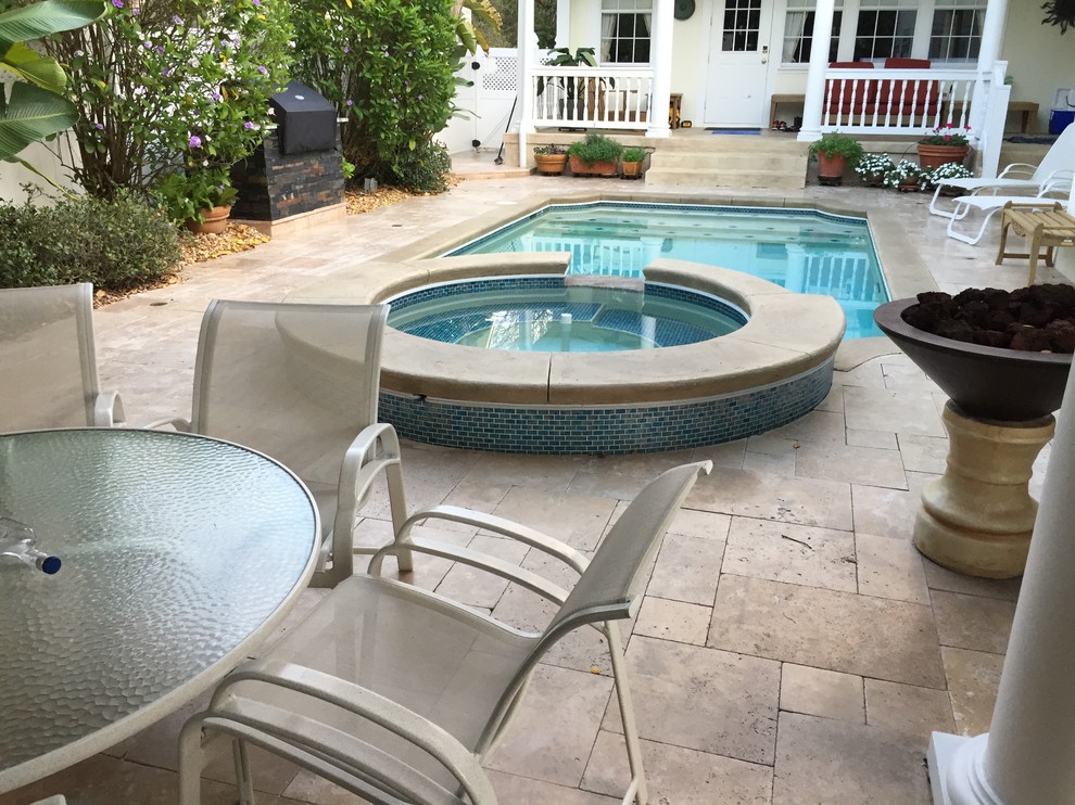 Medium sized mediterranean back custom shaped hot tub in Tampa with tiled flooring.