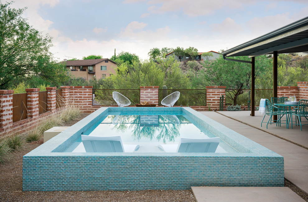 Pool - small southwestern backyard concrete and rectangular pool idea in Phoenix