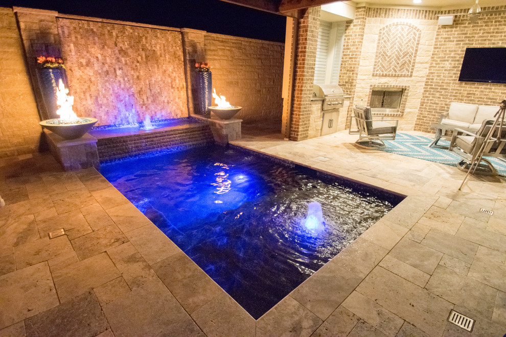 Small minimalist courtyard stone and rectangular hot tub photo in Dallas