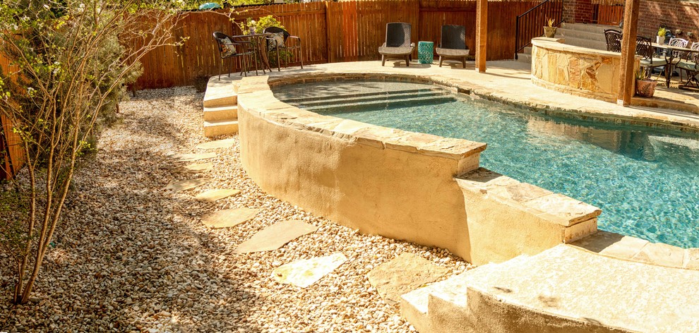 Mid-sized elegant backyard concrete and custom-shaped pool fountain photo in Austin