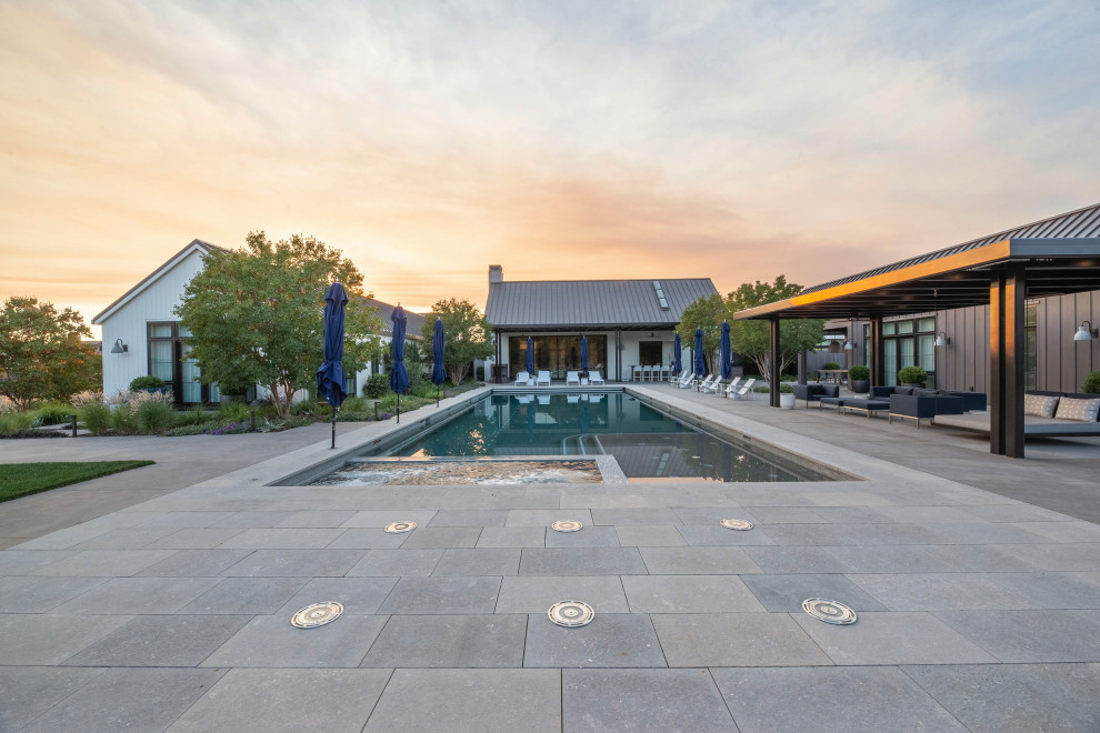 Inspiration for a large modern back rectangular swimming pool in San Francisco with concrete paving.