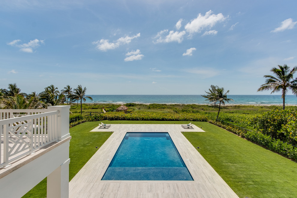 Inspiration for an expansive coastal rectangular infinity swimming pool in Miami.