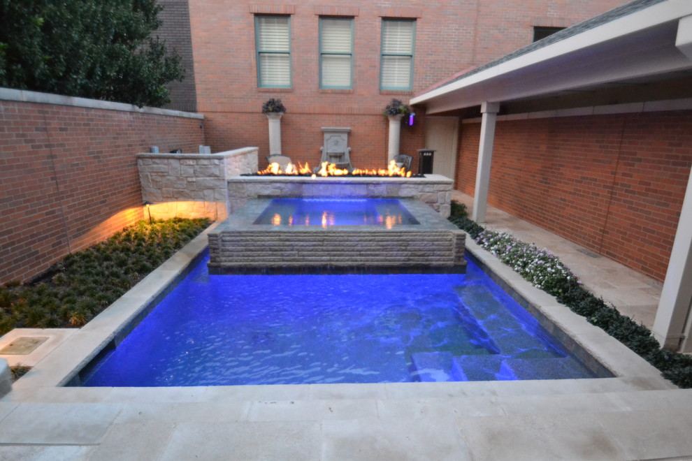 Design ideas for a medium sized contemporary back rectangular hot tub in Dallas with concrete paving.