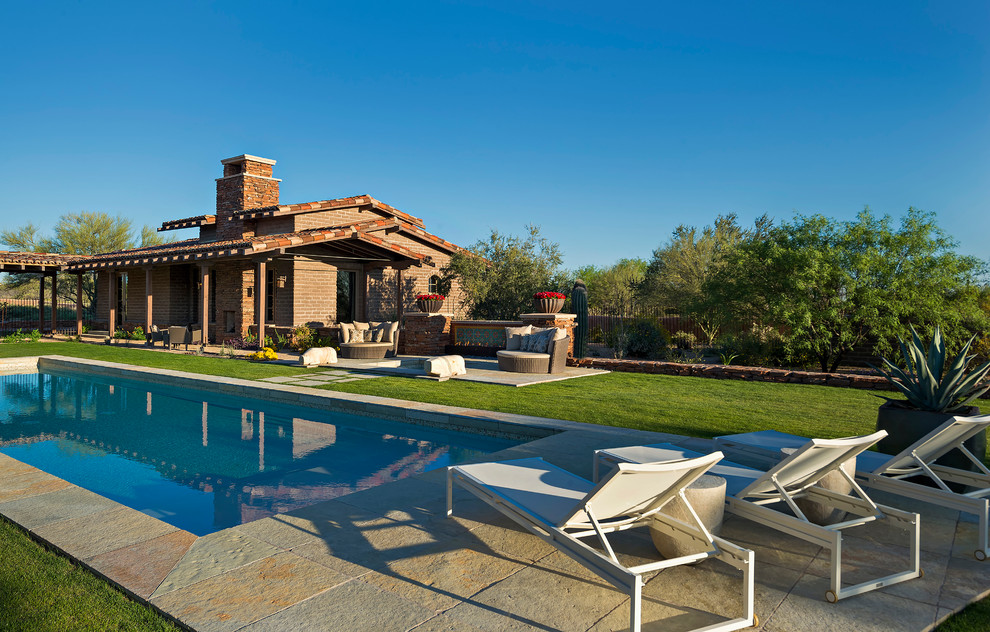 Southwest backyard rectangular lap pool house photo in Phoenix