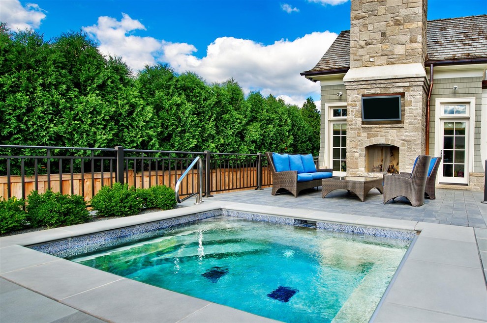 Hot tub - mid-sized traditional backyard rectangular and tile hot tub idea in Chicago