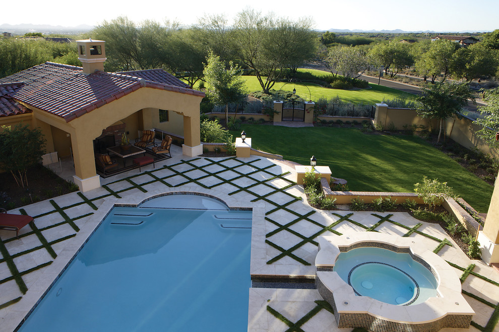 Inspiration for a large mediterranean pool remodel in Phoenix