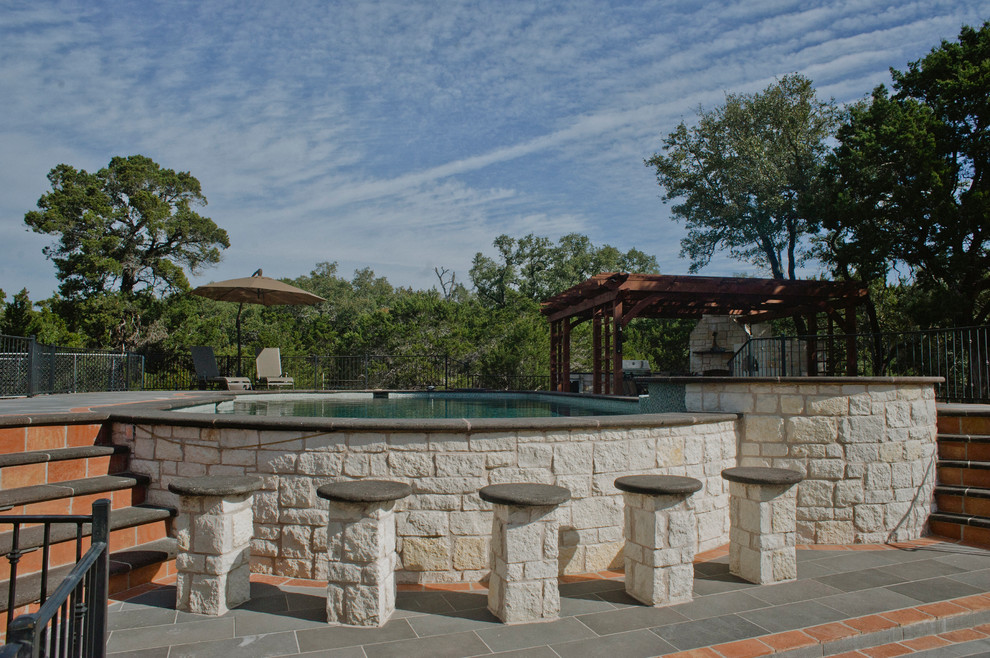 Hot tub - huge rustic backyard tile and custom-shaped aboveground hot tub idea in Austin