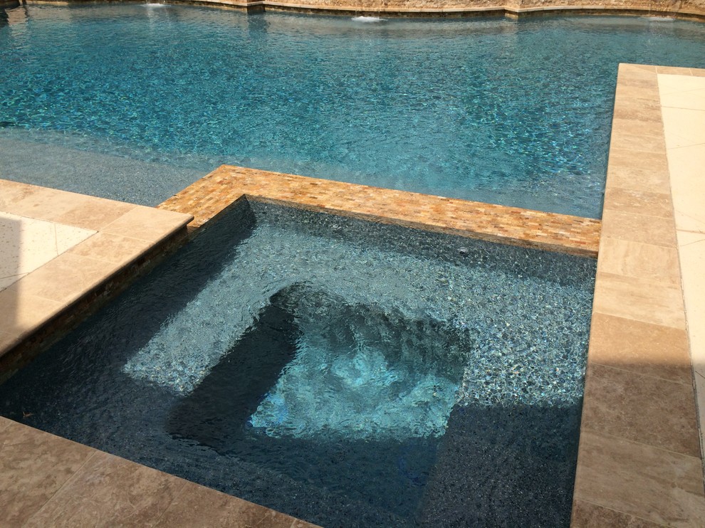 Photo of a traditional back hot tub in Houston with concrete slabs.