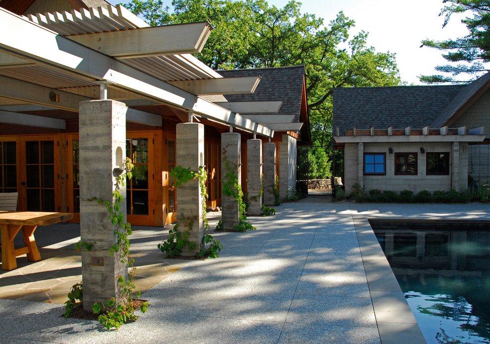 Свежая идея для дизайна: огромный прямоугольный бассейн в доме в стиле модернизм с водной горкой и покрытием из бетонных плит - отличное фото интерьера