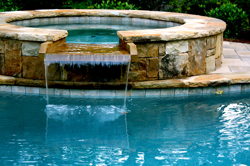 Stacked Stone Spa with Waterfall Spillover Traditional Pool