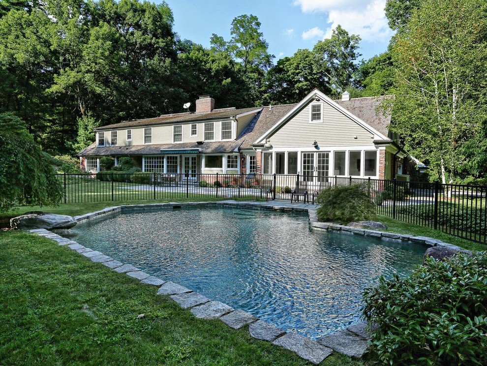Photo of a classic back custom shaped swimming pool in New York.