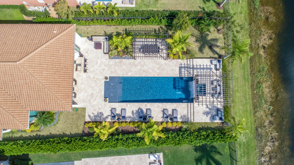 Straight Edge Pool in Parkland Florida with Custom Pergola and Tile Pool Miami by Van Kirk