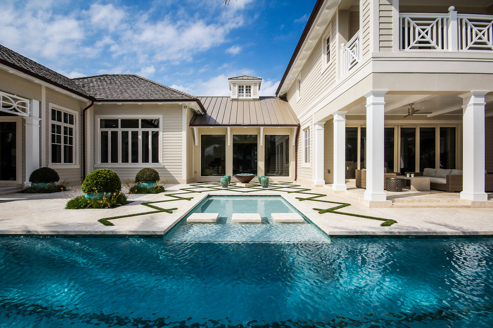 Example of a large minimalist backyard rectangular lap pool design in Miami