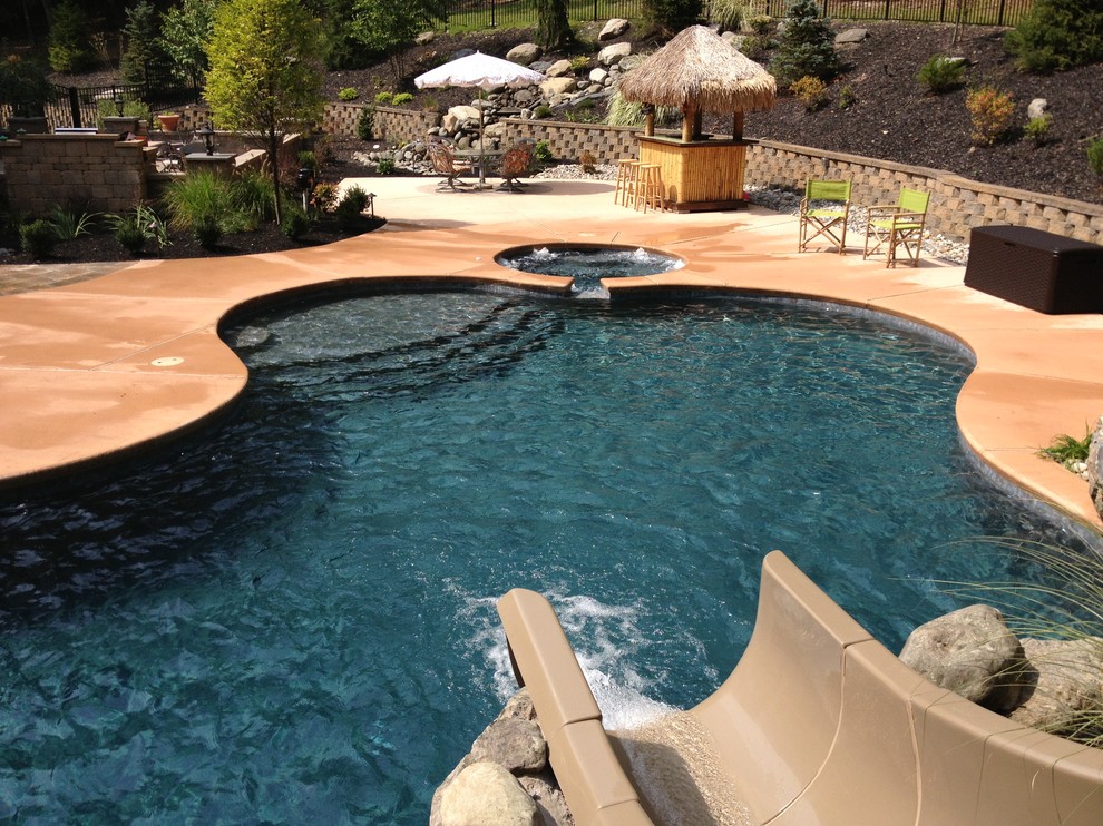 Design ideas for a traditional back custom shaped natural hot tub in Philadelphia with decking.