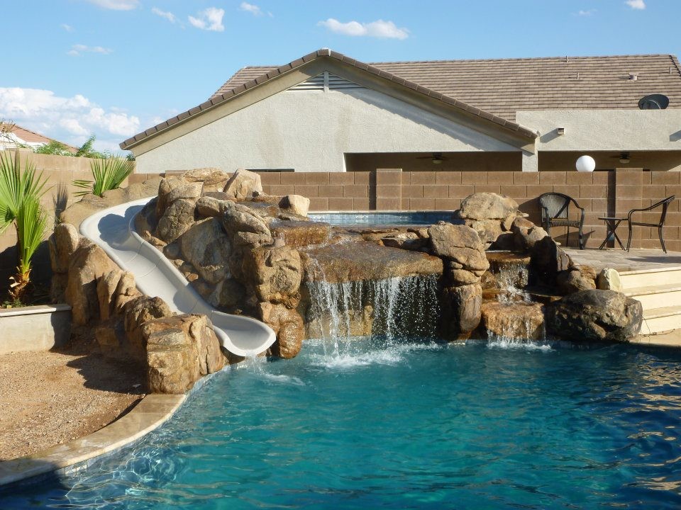 Example of a mid-sized backyard custom-shaped lap water slide design in Phoenix