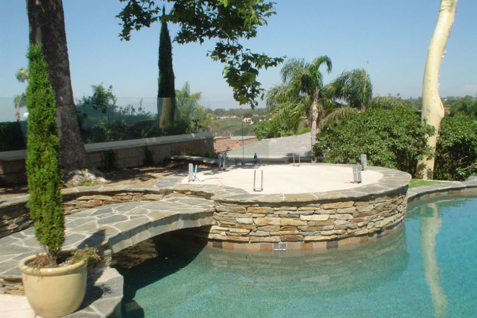 Photo of a medium sized classic back lengths hot tub in Orange County with concrete slabs.