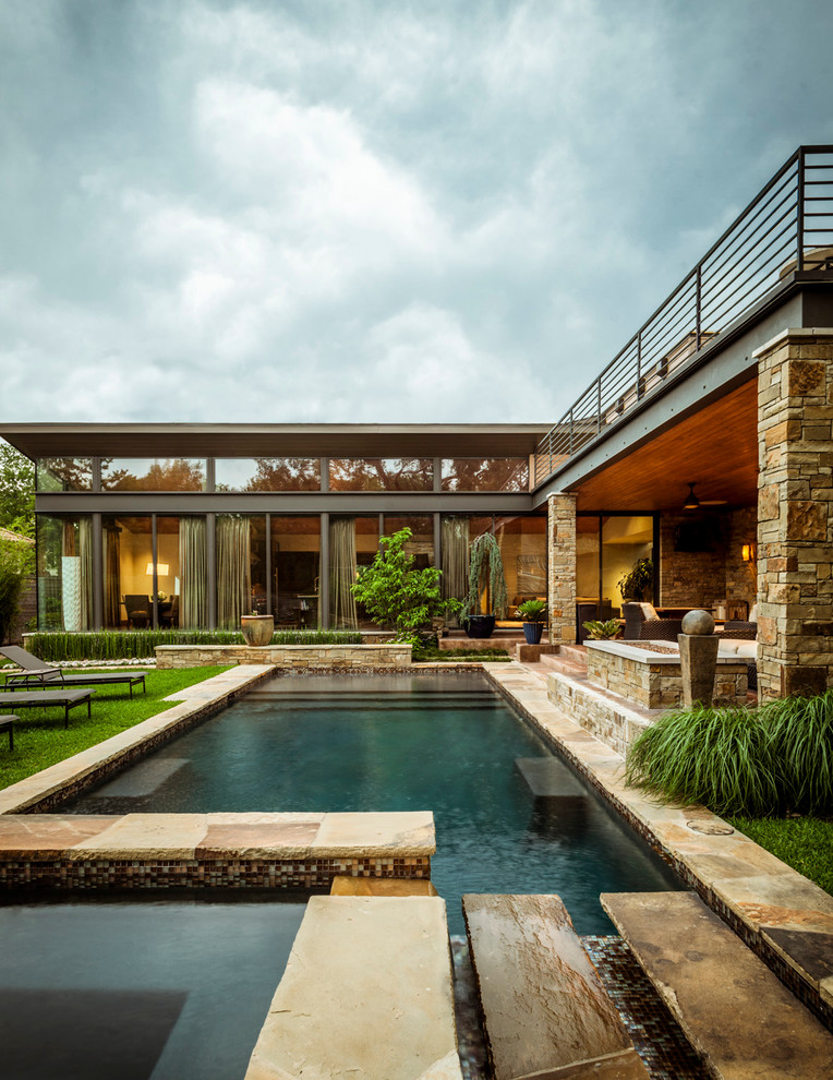 Inspiration for a contemporary rectangular pool remodel in Dallas