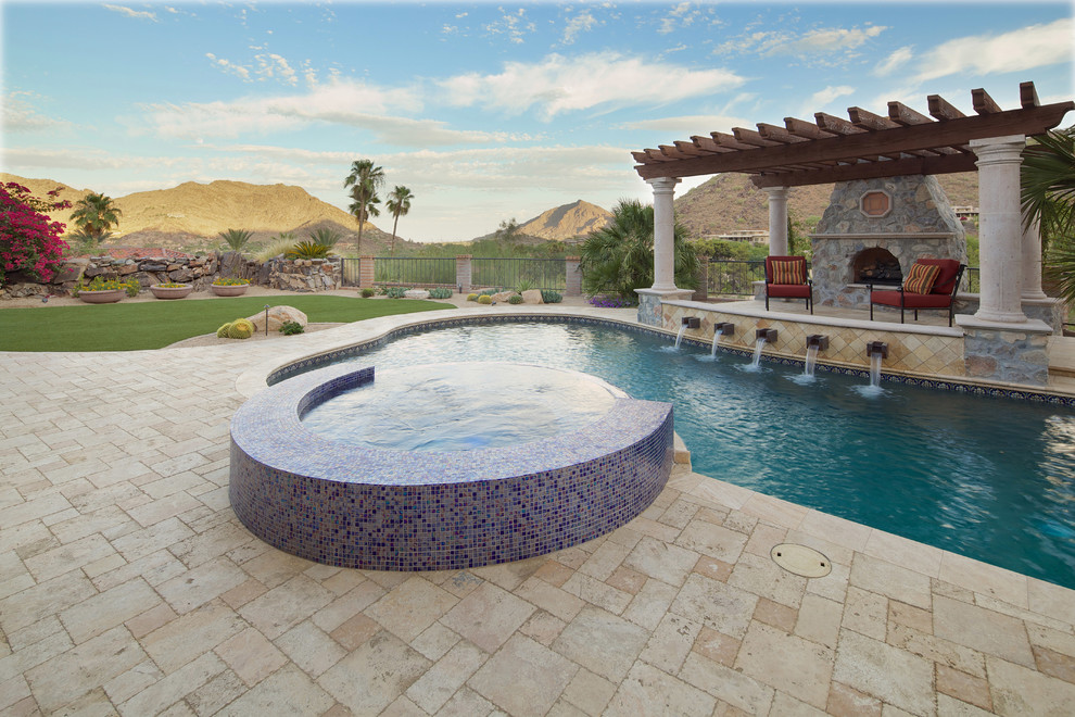 Pool house - large mediterranean backyard stone and custom-shaped natural pool house idea in Phoenix