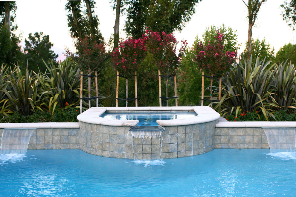 Mid-sized elegant backyard tile and custom-shaped lap hot tub photo in San Francisco