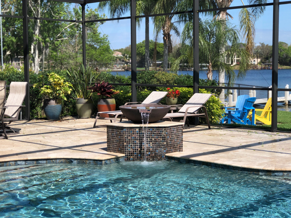 Foto di una piscina vittoriana personalizzata di medie dimensioni e dietro casa con pavimentazioni in pietra naturale