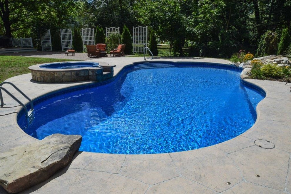 Foto di una grande piscina coperta chic personalizzata
