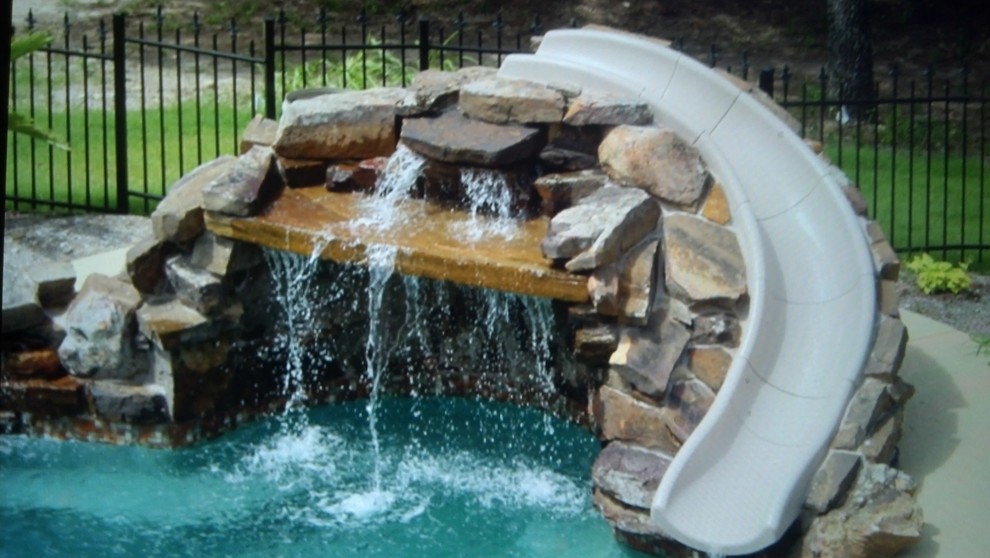 Swimming Pool with Slides and Waterfall Stone Features Transitional