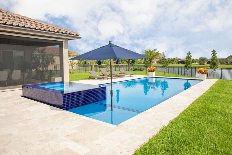 Swimming Pool with Wet Edge Raised Spa in West Palm Beach, Florida