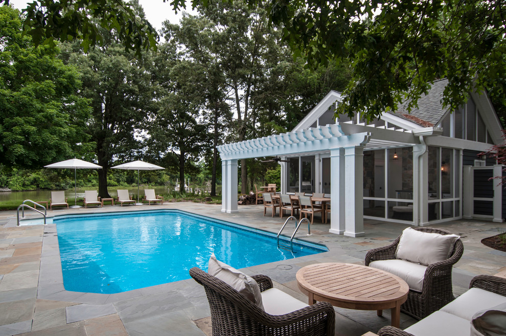 Pool house - large coastal backyard stone and rectangular pool house idea in DC Metro