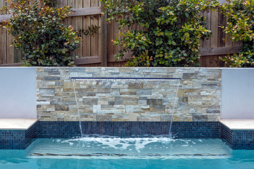 Large trendy side yard stone and custom-shaped lap pool photo in Brisbane