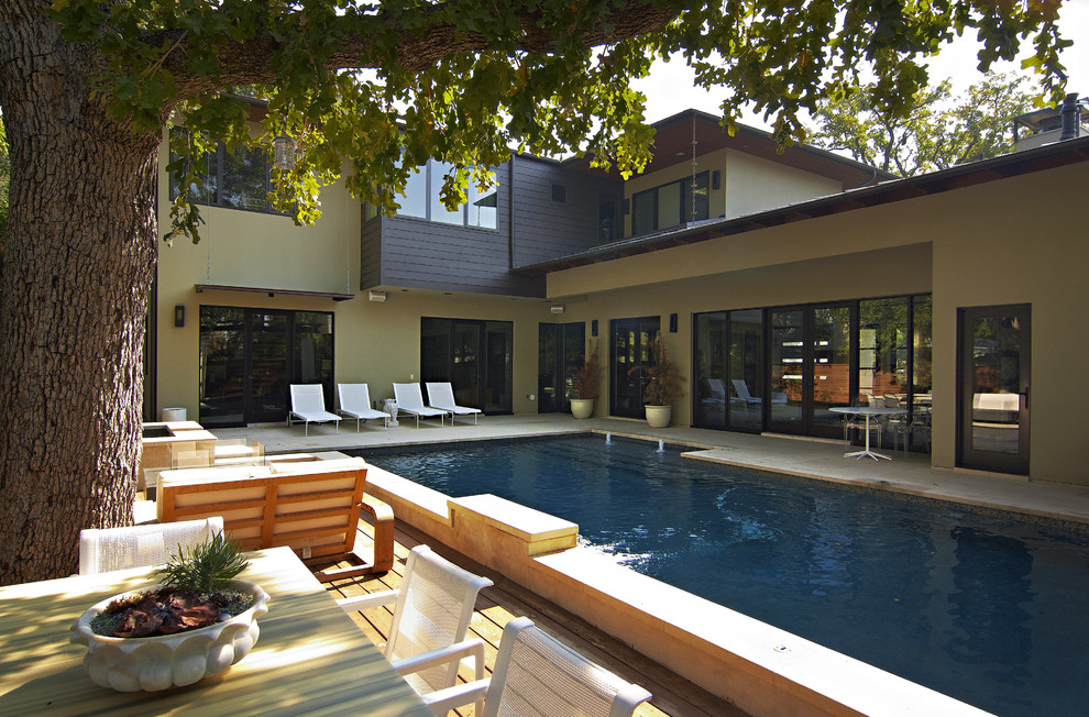 Inspiration for a contemporary backyard rectangular pool remodel in Austin